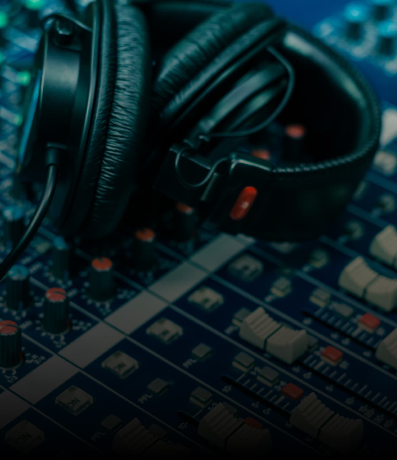 Audio production headphones on a mixing desk