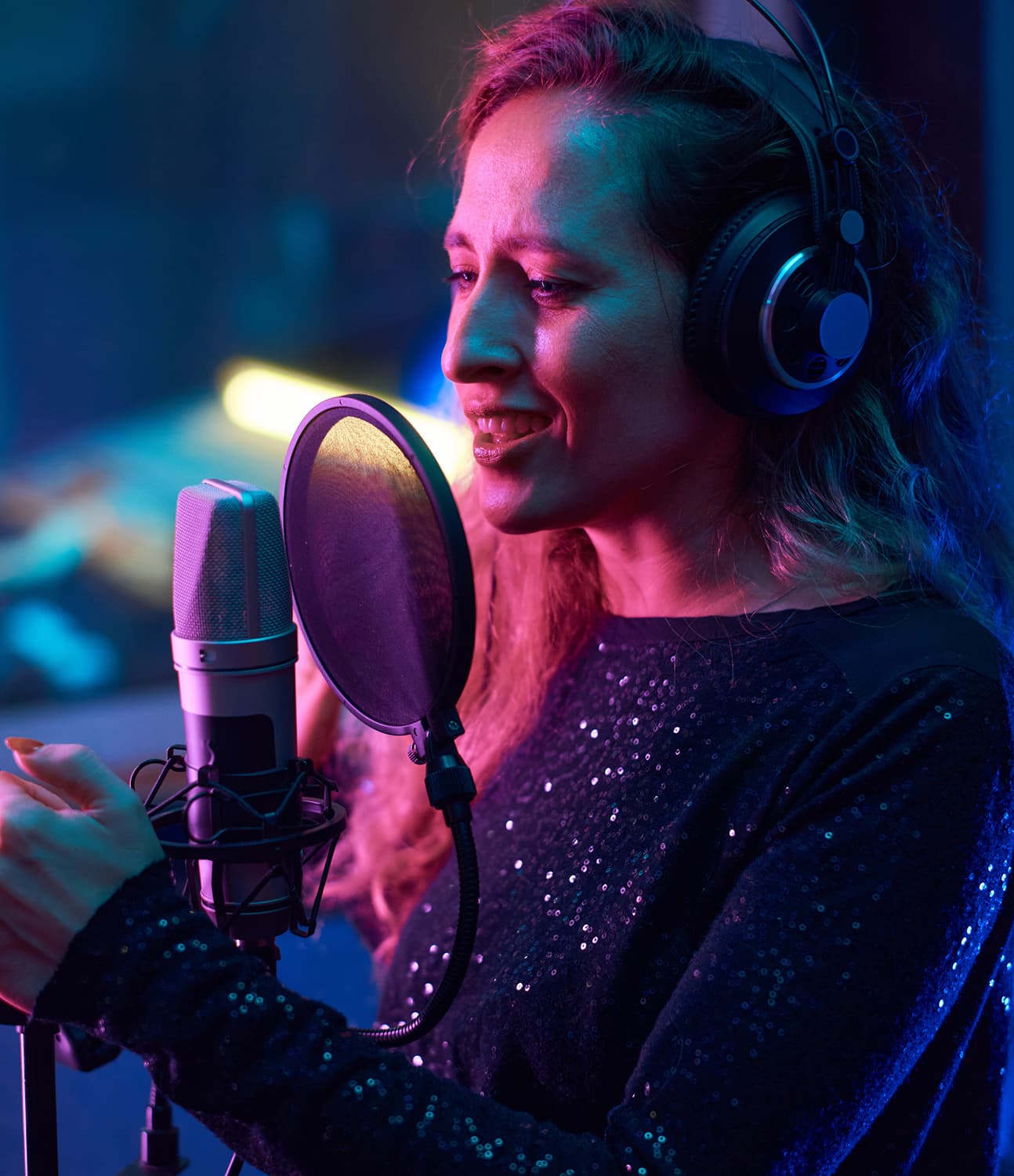 Voice-over artist recording in a booth